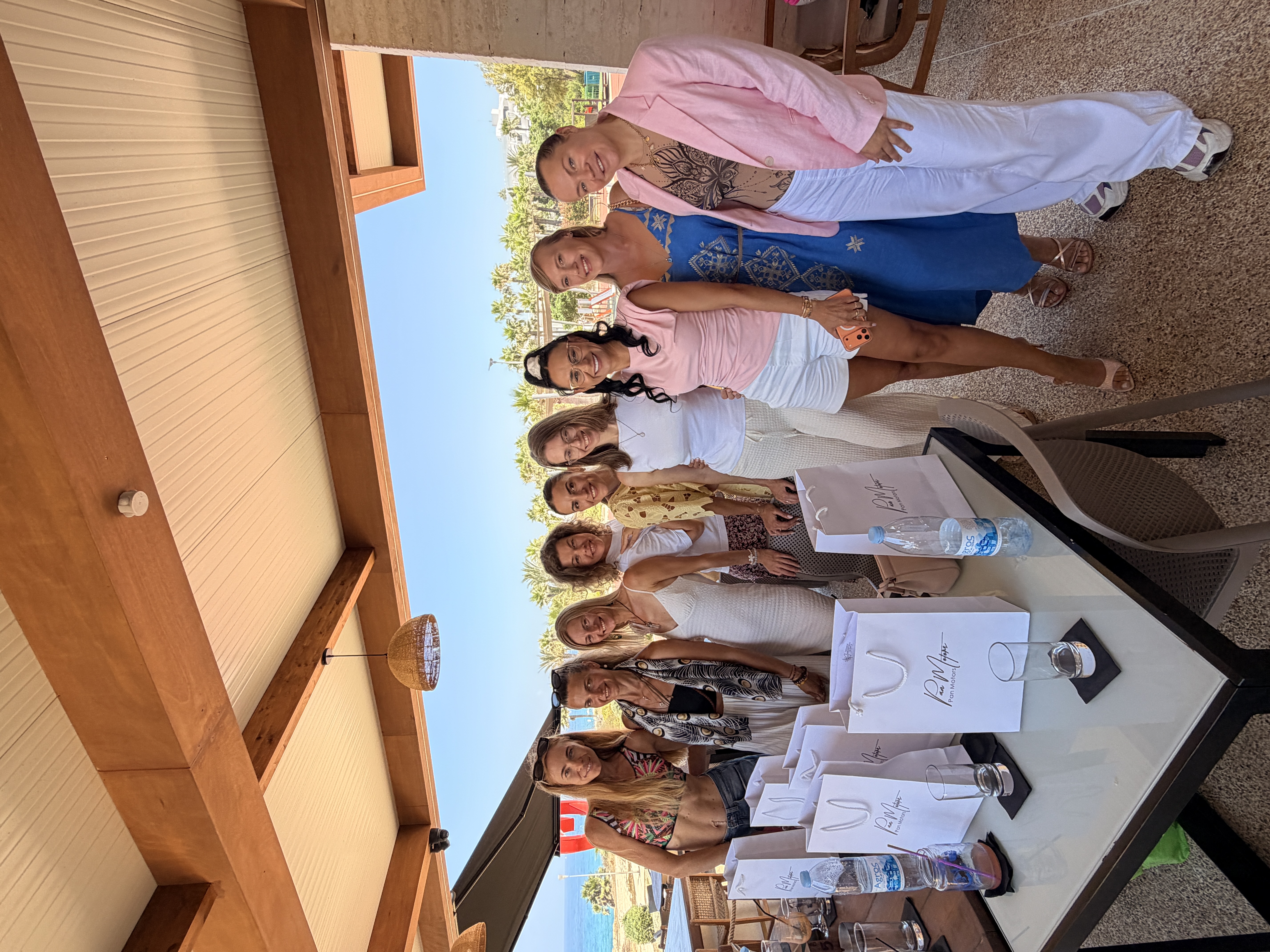The women of WPA together with gift bags overlooking the sea in Paphos, 1 July 2026