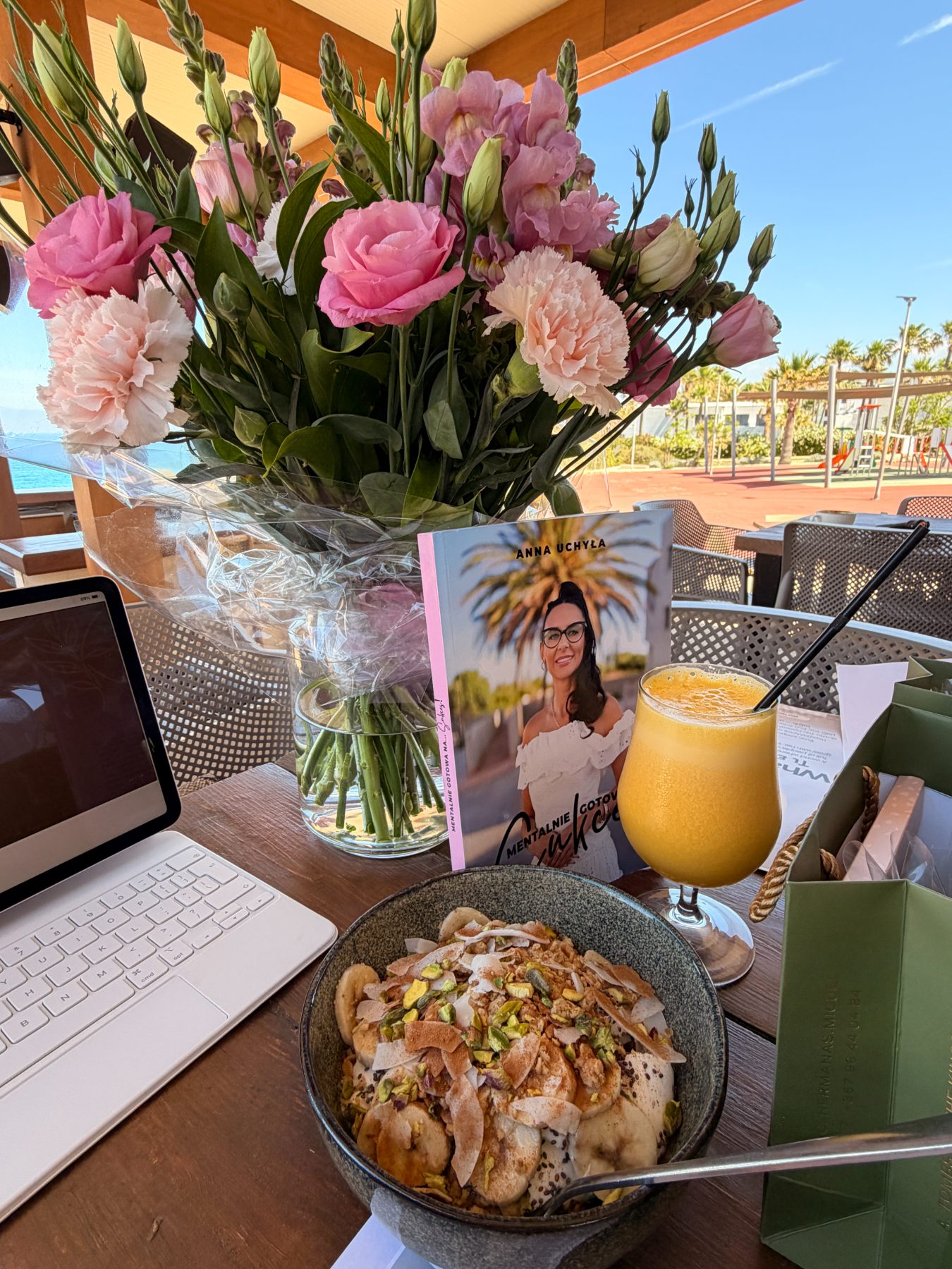 Flowers, Anna’s book and breakfast on the table